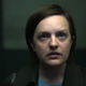 Elisabeth Moss, with short brown hair, stares at the ceiling in a scene from Shining Girls.